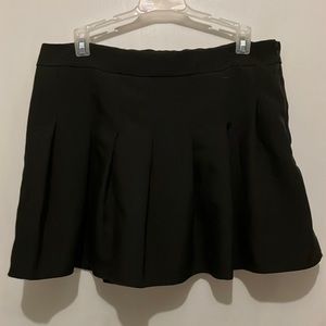 Pleated black mini-skirt